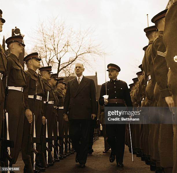Montreal, Canada: Pres. De Gaulle of France inspects a Guard of Honor at a wreath-laying ceremony at the Cenotaph while visiting Montreal.