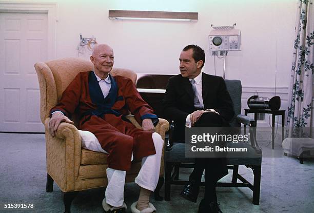 President Nixon pays a spur-of-the-moment call on former President Dwight D. Eisenhower at Walter Reed Army Medical Center in this photograph.