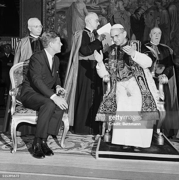 President Kennedy and Pope Paul VI sit and enjoy some conversation during their Meeting. The pontiff praised Kennedy for his "untiring" efforts to...