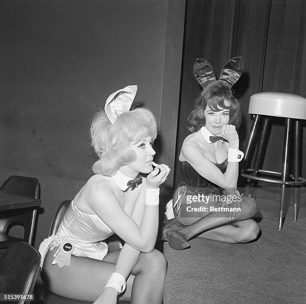 Two Playboy Bunnies resting at a Playboy club on Southeast Fifty Ninth Street in New York City.