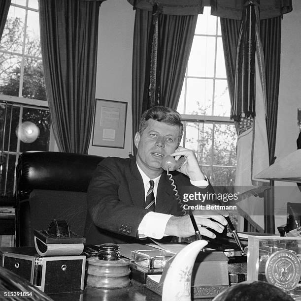President Kennedy is shown on the phone in his office at the White House as he spoke with former President Harry S. Truman in Independence, MO. The...
