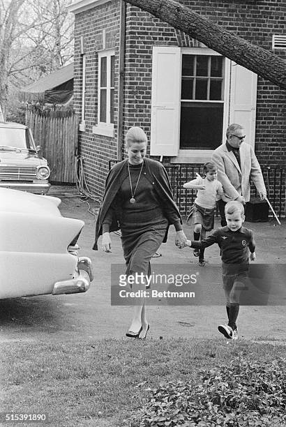 Philadelphia, PA: Princess Grace of Monaco has a tight grip on the hand of her son, Prince Albert, as Prince Rainier tries to keep up with daughter...