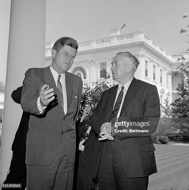 President Kennedy poses outside the White House today with British Labor Party leader Harold Wilson after their hour long conference. Wilson refused...