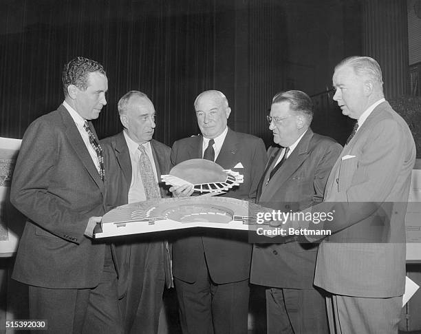 Pictured are Thomas Goodfellow, President of the Long Island Railroad; Robert Moses, Commissioner, Triborough Bridge and Tunnel Authority; Bernard...