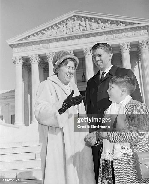 Mrs. Madalyn E. Murray, and her sons, William J. Murray and Garth Murray, 8 are shown as they left the Supreme Court today. The High Court began...
