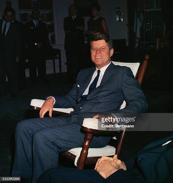 Washington, D.C.: A smiling President John F. Kennedy sits in a rocking chair in his White House office today on the eve of his 46th birthday. The...