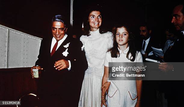 Bearing traces of confetti, Mr. And Mrs. Aristotle Onassis, , are shown at their October 20th wedding on Onassis' private island. Caroline Kennedy...
