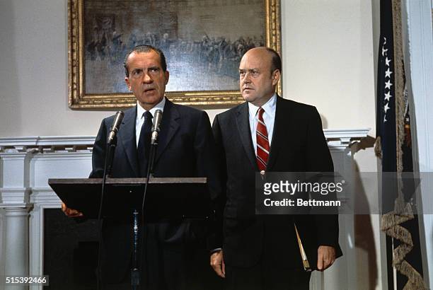 Secretary of Defense Melvin Laird, right, was on hand at the White House as President Nixon announced cancellation of draft calls for 50,000 in...