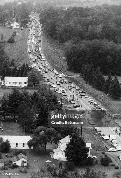 Aerial shows cars crowded on a highway about 10 miles from the Woodstock Music and Art Fair before some 450,000 young people head home from the three...