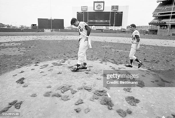 New York: Mets' pitchers Tom Seaver and Gary Gentry, who both won 1969 World Series games against the Orioles, survey the mound and what once was...