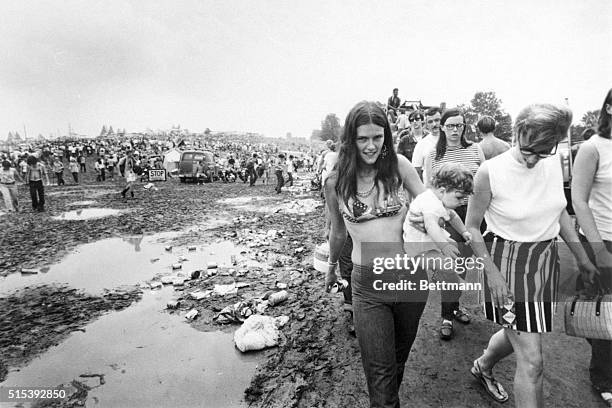 White Lake, New York: Rock music fans continue to pour into the Aquarius festival, despite mud, food shortages, and illness among the more than...