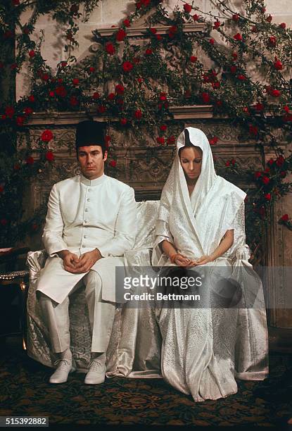 The Aga Khan and his bride, the former Lady Sarah Chrighton-Stuart sit sedately during the solemn Moslem religious wedding ceremony conducted in the...
