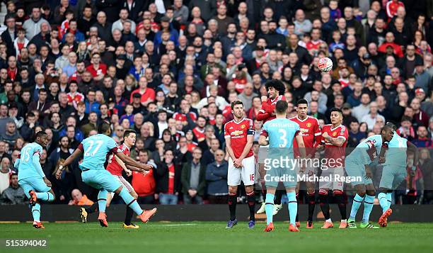 Dimitri Payet of West Ham United scores their first goal from a free kick during the Emirates FA Cup sixth round match between Manchester United and...