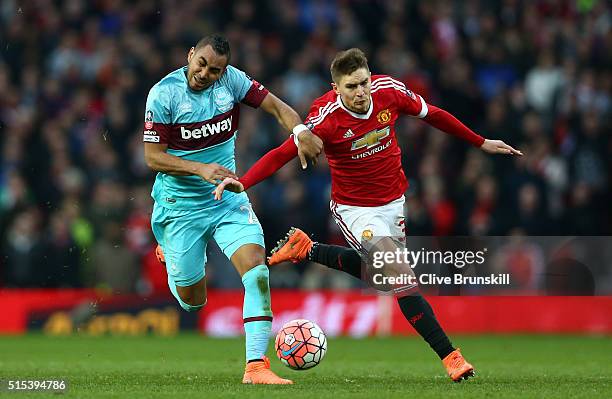 Dimitri Payet of West Ham United tussles with Guillermo Varela of Manchester United during the Emirates FA Cup sixth round match between Manchester...