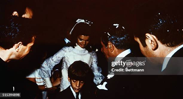 Bearing traces of confetti, Mr. And Mrs. Aristotle Onassis, , are shown at their wedding here on Onassis' private island.