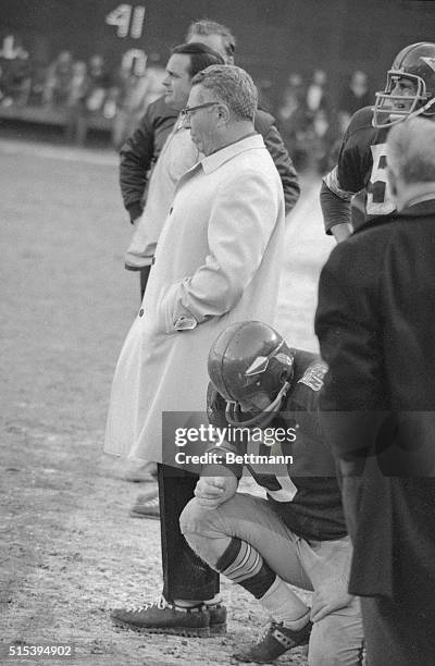 Washington Redskin quarterback Sonny Jurgenson with Coach Vince Lombardi on sidelines during game against Dallas Cowboys.