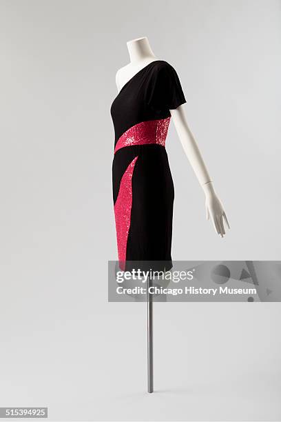 One-shouldered cocktail dress, designed by Karl Lagerfeld for Chloe, with red sequined triangular insets, 1982. Shown as part of the Chicago History...