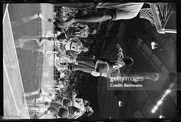 Milwaukee, WI- Milwaukee Bucks center Lew Alcindor, making his debut in the National Basketball Association, is shown making a hook shot in this...