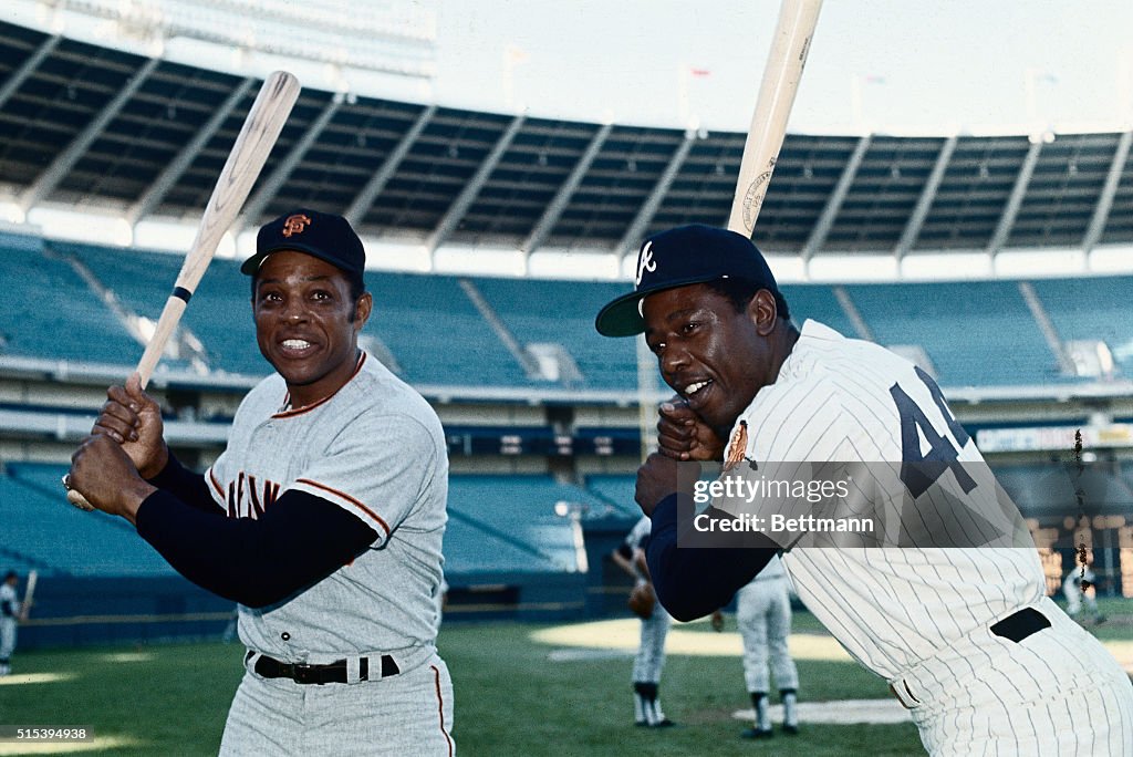 Hank Aaron and Willie Mays Holding Baseball Bats