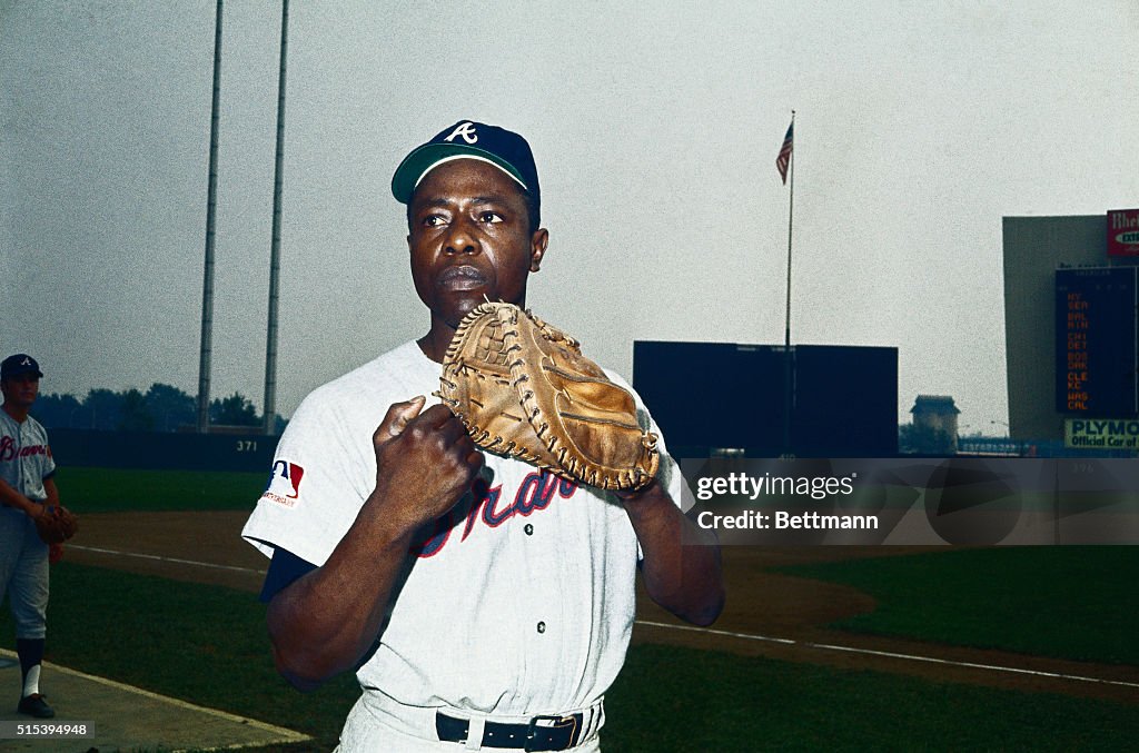 Hank Aaron Holding Baseball Glove