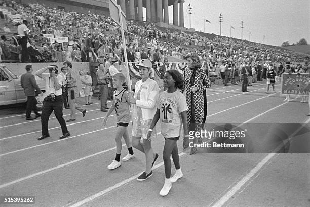 Chicago, Illinois: Mrs. Eunice Kennedy marches behind banner carriers of the Maryland delegation during parade of the delegations at opening...