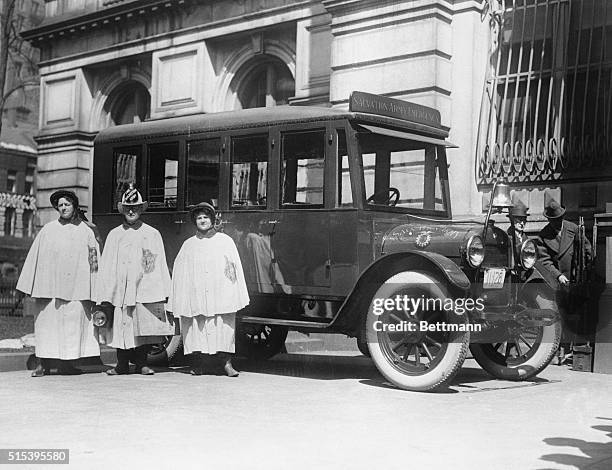 Boston gets first "Sally" Firemen's Lunch Auto. On behalf of the Salvation Army. Envoy Fuller (wearing first hat presented through Mayor Culrey of...