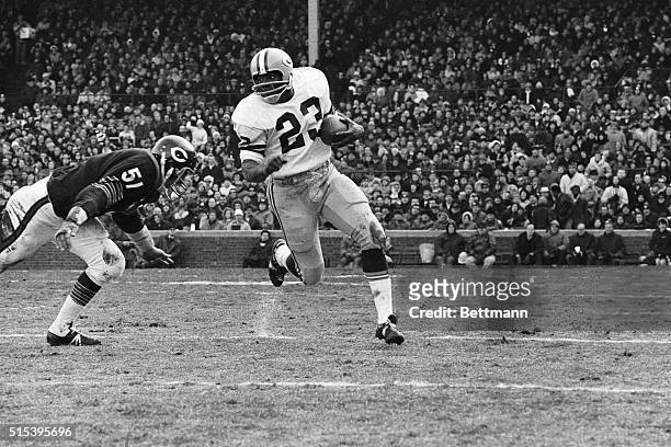 Chicago Bears linebacker Dick Butkus charges, head down, to bring down Green Bay Packers running back Travis Williams, who made short gain in and run...