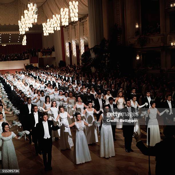 Vienna, Austria: the Vienna Statsoper, , held an Opera Ball at which debutantes were presented. White clad debutantes and their escorts open the ball.