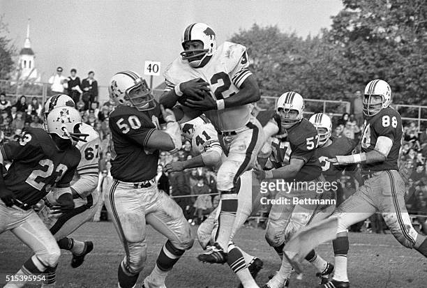 Simpson , of the Buffalo Bills, streaks through the air as Jim Cheyunski , of the Boston patriots, moves in for the tackle during 3rd quarter action....