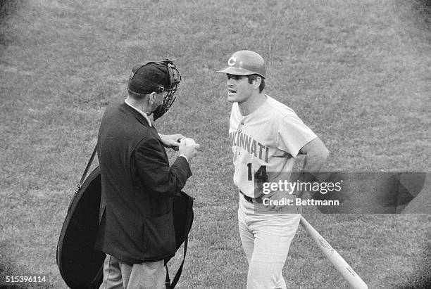 Reds' Pete Rose argues with home plate umpire Bob Stewart over whether a batted ball Rose hit tipped his foot before it went to Orioles' Boog Powell...