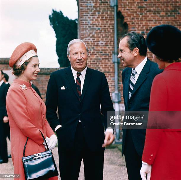 In the Premier's Garden. Checquers, Nr. Wendover, Bucks: Admiring the garden of the Prime Minister's country home of Checquers are Mrs. Pat Nixon;...