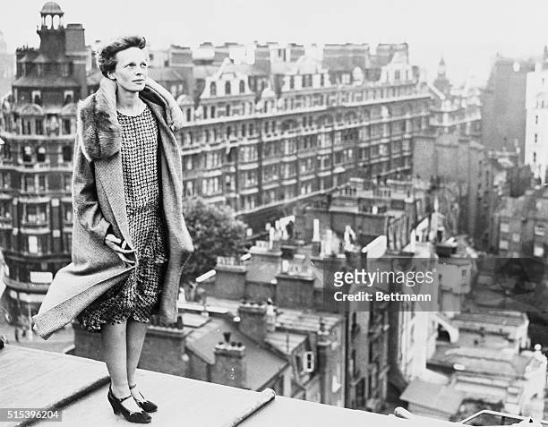The above photo shows Miss Amelia Earhart, copilot of the transatlantic plane, Friendship, atop the roof of the Hyde Park Hotel in London, getting a...