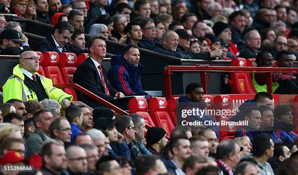 Louis van Gaal manager of Manchester United and Ryan Giggs assistant manager of Manchester United look on from the bench during the Emirates FA Cup...
