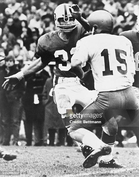 Penn State's Jack Ham Linebacker closes in on an unidentified QB.
