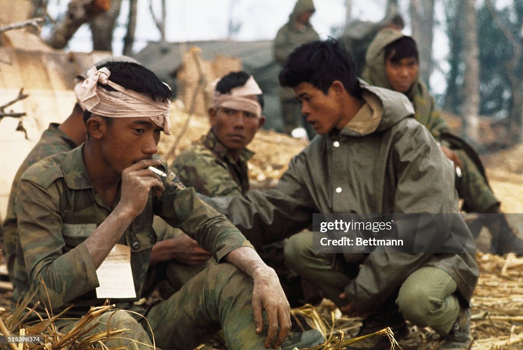 Soldiers with Head Wrapped Waiting for Treatment