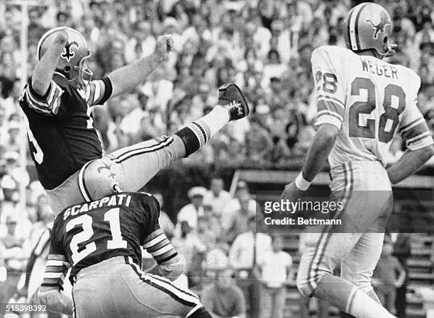New Orleans: Record Kick. Saints field goal expert Tom Dempsey watches one of his kicks split the uprights during first half action here Nov. 8th, as...