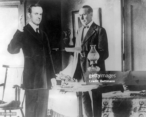 How President Coolidge appeared in a room at his father's house when he took the oath of office by kerosene light is shown here. Coolidge took office...