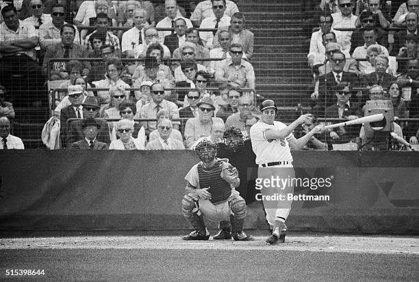 Orioles' Brooks Robinson connects for a home run in the 4th game of the World Series 10/14. Reds catcher is Johnny Bench and umpire is Bob Stewart.