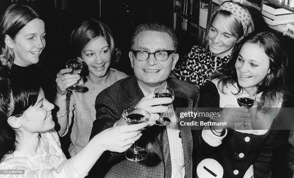 Paul Samuelson Offering Toast with Staff Members