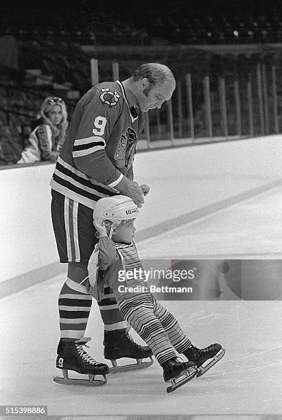 Another member of the Golden Jet family moves onto the ice. This time, it is Bart Hull, 2 1/2, son of Chicago Black Hawk star Bobby, who is helping...