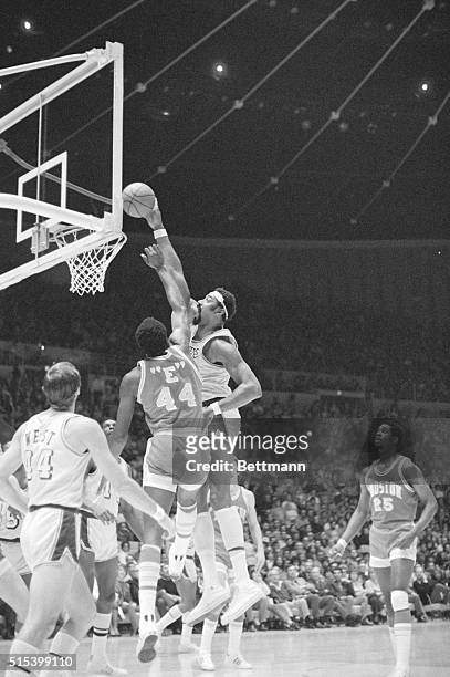 Inglewood, California: Lakers Wilt Chamberlain, 7-foot 1-inch, does not have far to go off the floor to slam one in for two points as Houston Rockets...