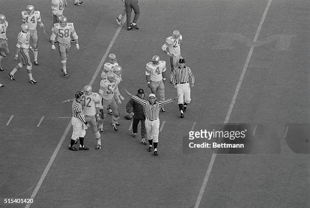 Protecting a Michigan interception call, irate Ohio State coach Woody Hayes berates an official during the fourth quarter of Michigan Ohio State game...