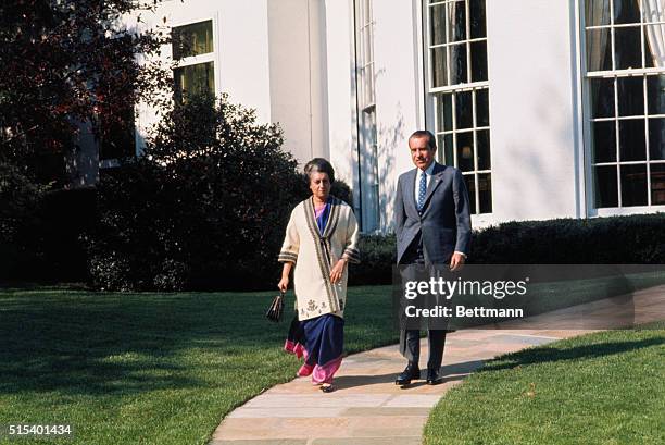 Washington, DC.: President Richard Nixon escorts Indian Prime Minister Indira Gandhi from the White House after a 70-minute meeting. Nixon's Press...