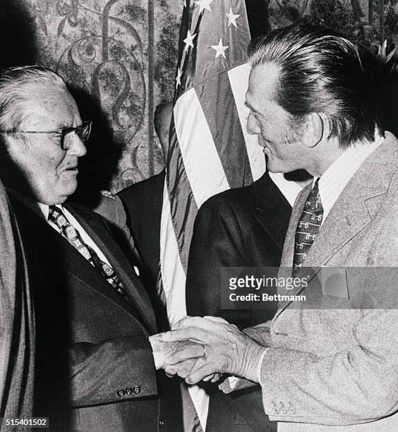 Hollywood: Yugoslavian President Josip Broz Tito chats with actor Kirk Douglas at a reception hosted by the Motion Picture and Television Producers...