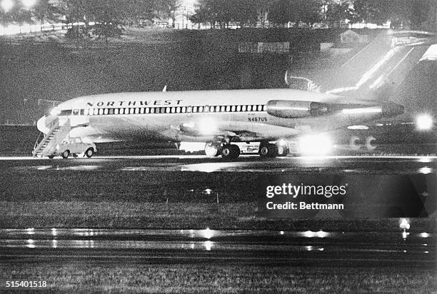 Seattle: Northwest Airlines 727, hijacked on a flight from Portland, Oregon to Seattle, sits on the ground here 11/24. Before being refueled and...