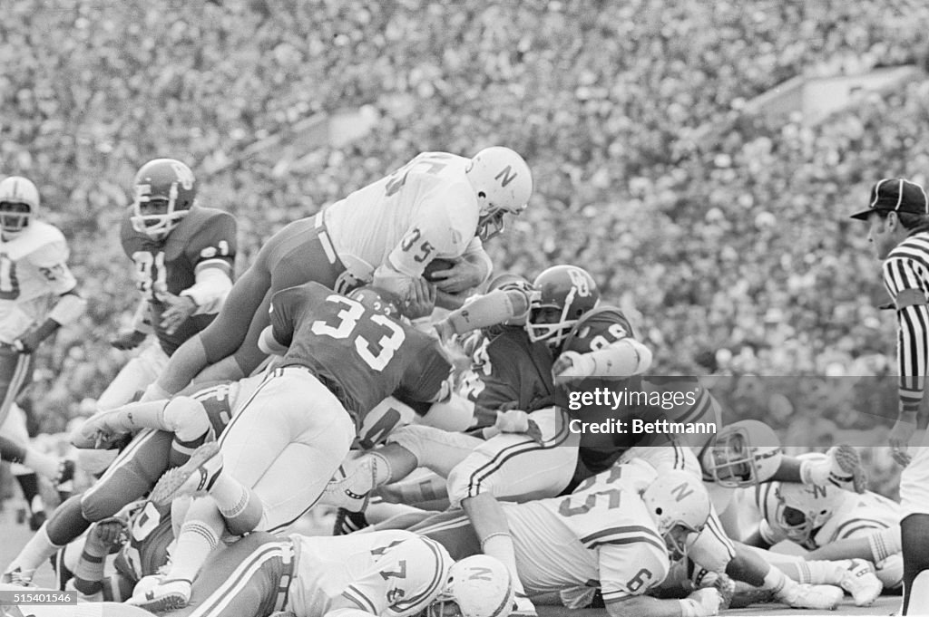 Nebraska's Players in Huddle During Football Game