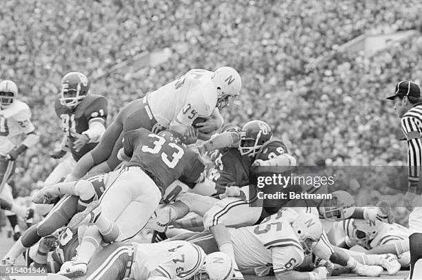 Normal, Oklahoma: Nebraska's running back Jeff Kinney, , leans high over the Oklahoma line to score a touchdown from the one yard line in the second...