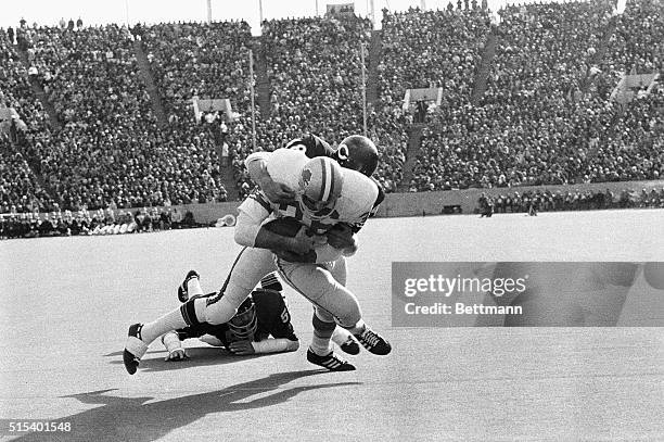 Detroit Lions' Steve Owens crosses the goal line carrying the ball and Bears' player Ron Smith as Bears' middle linebacker Dick Butkus views the...