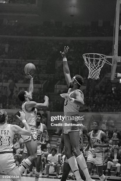 High Block. New York: Wilt Chamberlain of the Los Angeles Lakers goes high to block shot by Dave Bing of the Detroit Pistons during their exhibition...