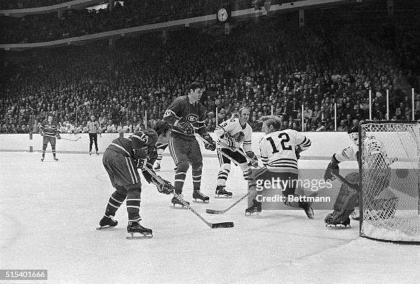 Yvan Cournoyer, of Montreal , scores the first Canadiens' goal in first period in Chicago Stadium as he gets shot past Black Hawks goalie Tony...